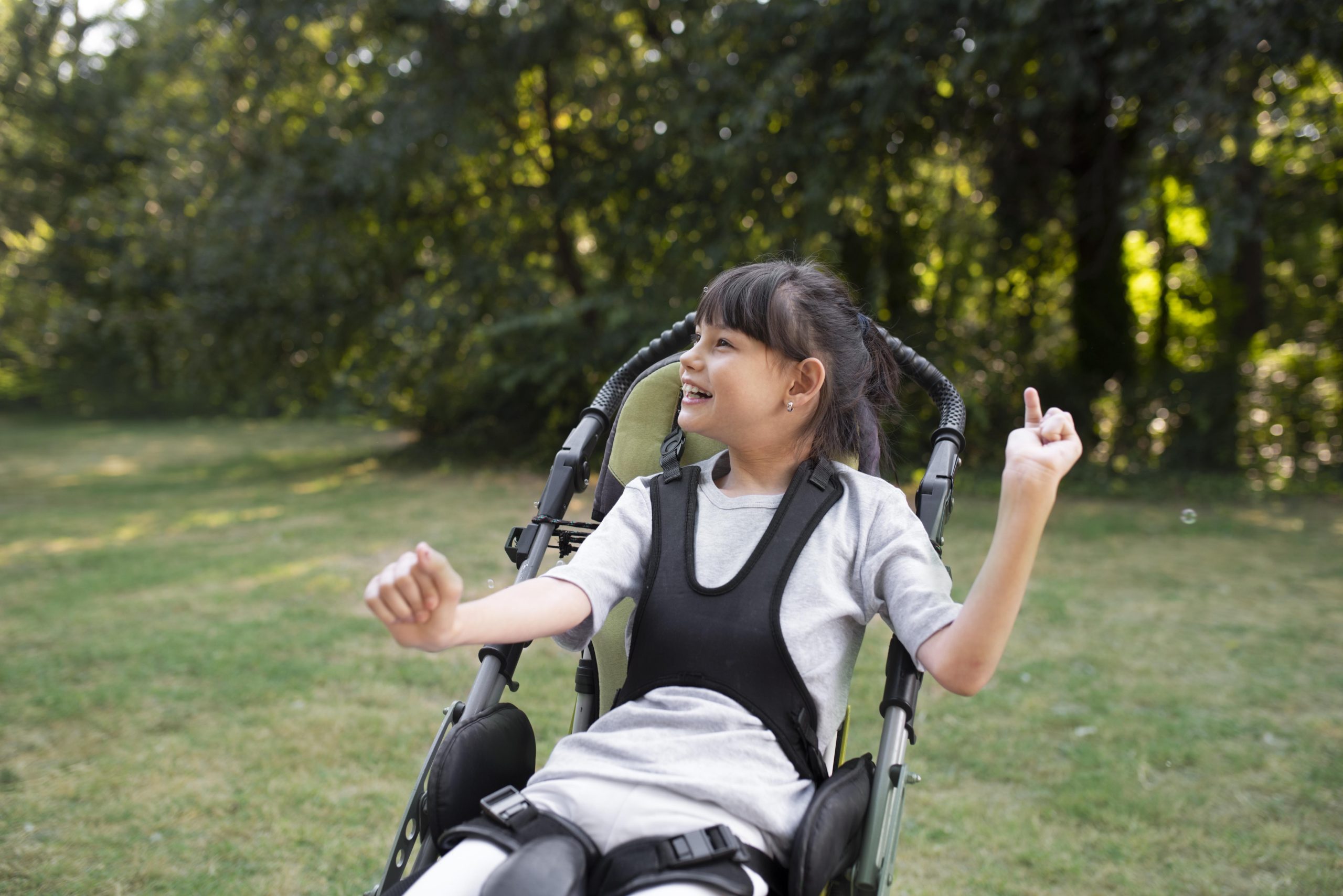 Child using a REAL Child adaptive mobility chair at home